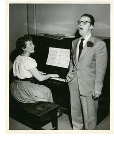 Suffolk University student singing at unidentified event, 1950s