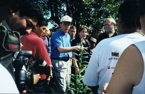 John Joseph Moakley and James P. McGovern speaking to a group in a field in El Salvador, 13 November 1999
