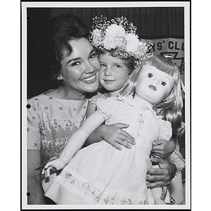 Mary Ann Mobley, Miss America 1959, and the Little Sister Contest winner holding a doll