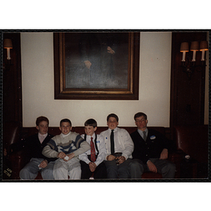 Five boys sitting on a couch together at the "Recognition Dinner at Harvard Club"