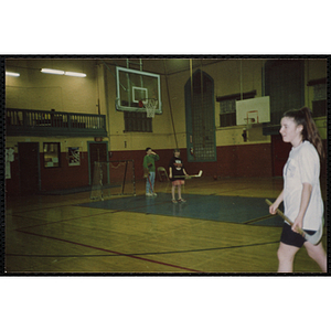 Teenagers play floor hockey