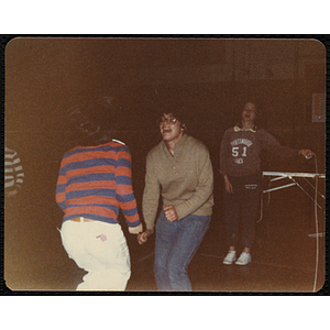 Two girls skip rope at a party