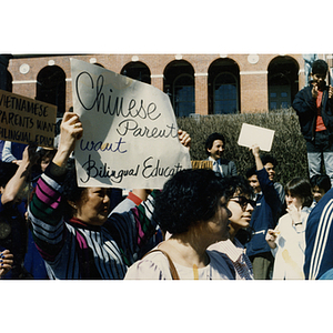 Demonstrators protest in front of the Massachusetts State House at a rally for bilingual education in schools