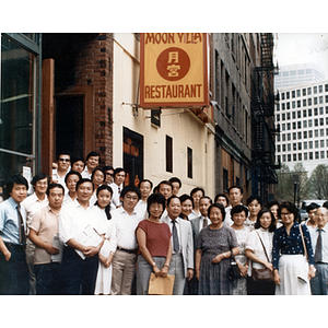 Chinese Progressive Association members standing outside Moon Villa Restaurant