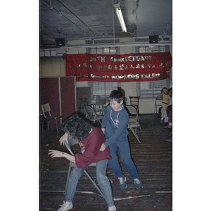 Children play musical chairs at a Garment Workers' Center celebration