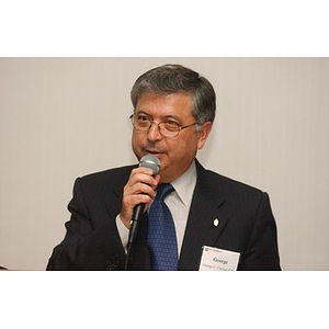 George C. Chryssis speaks into a microphone at The National Council Dinner