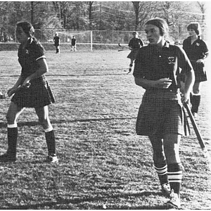 Two Northeastern women's field hockey players and an opponent