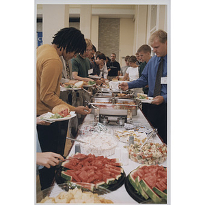 Attendees of the School of Law orientation at the buffet table, 1998
