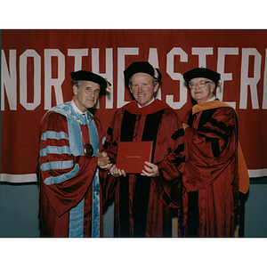 President Curry with honorary degree recipient William McDonough and his escort