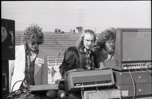 Hollywood Speedway Rock Festival: three men working at the mixing board