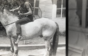 Commune member riding bareback on a horse