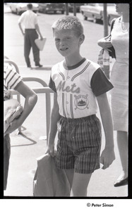 Mets at Shea Stadium: boy with freckles waits in line