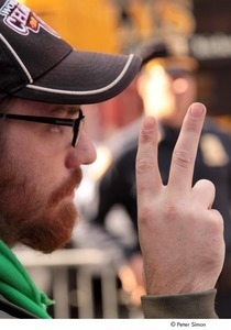 Occupy Wall Street: demonstrator flashing the peace sign