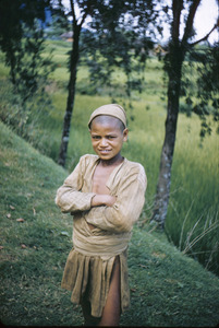 Poor rural child wearing a cap