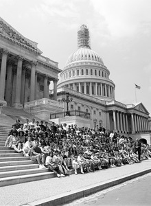 Congressman John W. Olver and visitors, posed on the steps of the United States Capitol building
