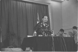 General Nguyen Khanh announcing air raid against North Vietnam; Saigon.
