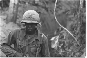 Operation Crimp. U.S. soldiers searching Vietcong trenches; Hau Nghia ...