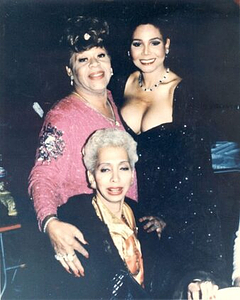 A Photograph of Marlow Monique Dickson Posing with Friends in Formalwear