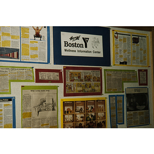 Articles, pictures and comics displayed on a wall at the Boston Young Men's Christian Association