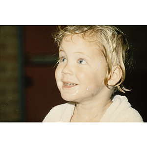 Child smiling after swimming