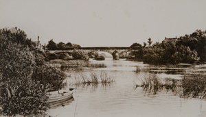 View of a stone bridge crossing the river Marne