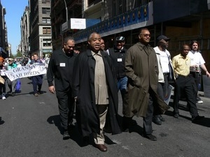 Jesse Jackson and Al Sharpton (center) at the head of a group protesters marching down East 17th Street