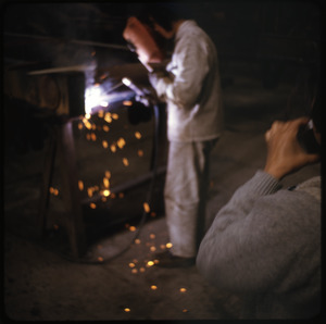 Woman welder at truck factory
