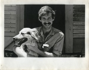 Jim Aaron, holding a dog, Montague Farm Commune
