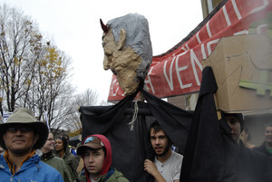 UMass student strike: strikers with banners and large paper machie puppet