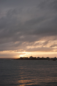 Houses on a point of land at sunset