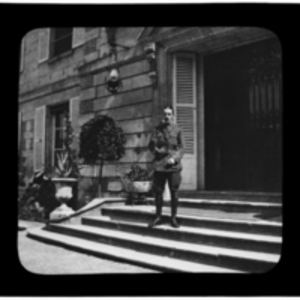 Soldier stands on the front steps