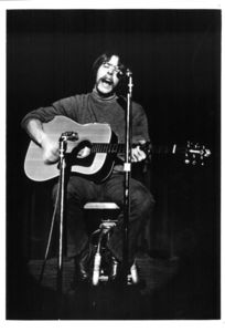 Suffolk University student performing at unidentified event, 1970s