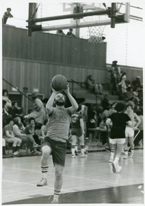 Paul Tenney participating in a layup drill at Madison Park High School