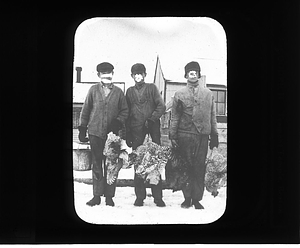 Boys holding poultry