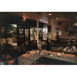 Richard Thal (left), Inquilinos Boricuas en Acción's Assistant Director, and Clara Garcia (right), Inquilinos Boricuas en Acción's Executive Director, with others at a local restaurant.