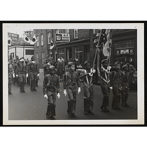 Boy Scouts from Troop 57 marching in a parade