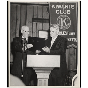 Tip O'Neill accepts a certification at the Kiwanis Club's Bunker Hill Postage Stamp Luncheon