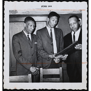 "Boy of the Year, Oswald Gooden with father and Otis Cash"
