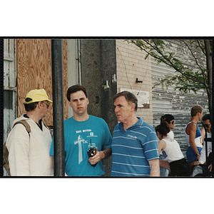 Former Boston mayor Ray Flynn (right) stands with race officials at the Battle of Bunker Hill Road Race