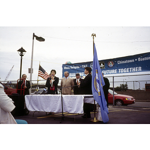 Speaker addresses assembled activists at their victory ceremony