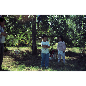 People in an orchard on a Chinese Progressive Association trip