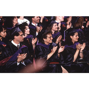 School of Law graduates clapping at the commencement ceremony for the Class of 1992