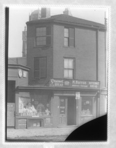 View of building housing M. Barron, Grocer and Provisions, probably on Dorchester Ave.