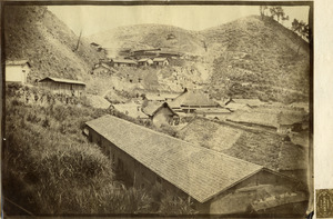 View of buildings and mountainside in Hamada