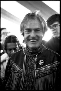 Timothy Leary surrounded by press and supporters