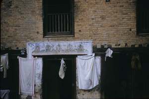 Laundry hanging outside a doorway