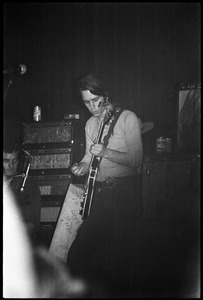 Grateful Dead performing at the Music Hall: Bob Weir playing guitar with drummer Bill Kreutzmann on the left