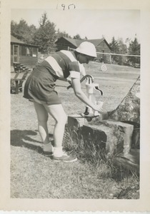 Bernice Kahn using a water pump