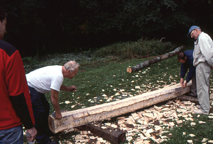 Hopkins Forest Fall Festival, 2000. Richard Babcock (white tee-shirt and dark blue trousers) finishes a beam.