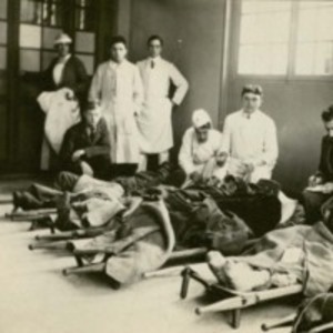 Photograph of wounded soldiers on stretchers at American Ambulance Hospital.